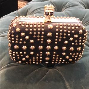 Small black and gold studded clutch